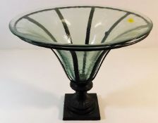 A decorative flared glass table centrepiece with b