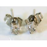 A pair of 9ct white gold diamond earrings 0.7g