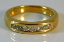 An 18ct gold diamond half eternity ring of approx.