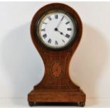 A French Edwardian oak cased balloon clock with in