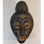 An African Punu-Lumbo style mask 15in tall