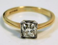 An 18ct gold ring with white metal shank set with an old cut approx. 0.65ct cushion shaped diamond