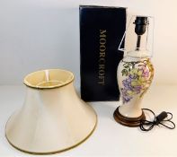 A boxed Moorcroft pottery lamp, unused with shade