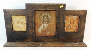 An oak mounted icon triptych 26in wide x 13in high