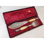 An antique cased silver plate & ivory fish serving