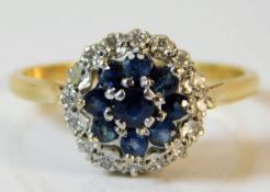 An 18ct gold ring with platinum mounted diamond &