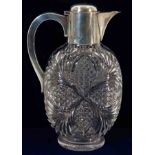 A late Victorian cut glass claret jug with a robus