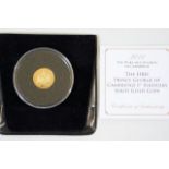 A gold proof coin commemorating first birthday of