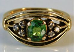 An 18ct gold ring set with tsavorite & diamond 5.6