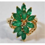 A 14ct ring of organic set with diamond & emerald