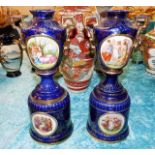 A pair of decorative pedestal vases