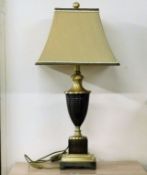 A decorative lamp with shade 28in tall