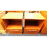 A pair of teak G-Plan bedside cupboards with drawe
