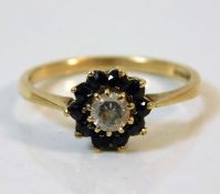 A 9ct gold ring set with sapphire & white stone size O/P 2.1g