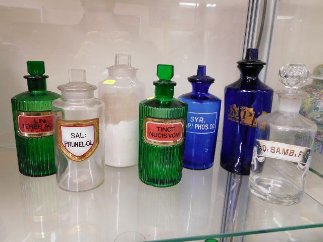 A quantity of poison bottles some with labels