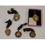 Five silver 1930's sports medals, three with rose
