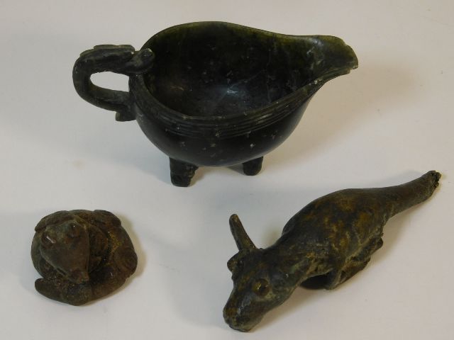 A small jade style jug, some faults twinned with t