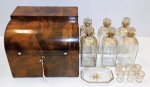 A gilded six bottle Regency period decanter set wi