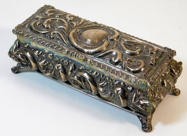 An embossed hallmarked silver box