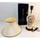 A boxed Moorcroft pottery lamp, unused with shade