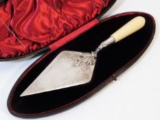 A Victorian ivory handled silver ceremonial trowel with case, young head, slightly rubbed marks 330g