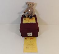 A boxed resin Steiff Lilac bear 14cm