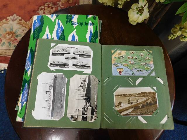 A postcard album twinned with two others, both mod
