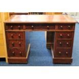 A small antique knee hole desk with nine drawers 4