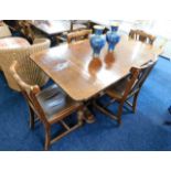 A c.1940 oak art deco style extending dining table