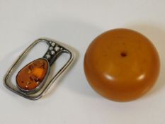 A white metal & amber brooch with a large amber st