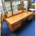 A G-Plan teak dressing table with mirrors 53.5in w