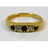 An 18ct gold ring set with diamond & sapphire size
