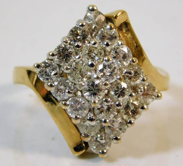 A 14ct gold ring set with 1.4ct diamonds size R 7.