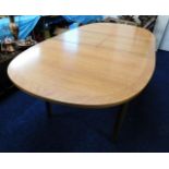 A Nathan teak extending dining table 81in long x 3