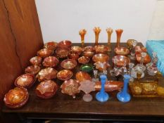 A large quantity of mostly carnival glass items in