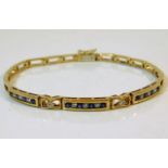 A 9ct gold diamond & sapphire bracelet 10.3g