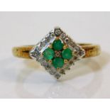 A 9ct gold ring set with emeralds & diamonds size
