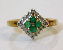 A 9ct gold ring set with emeralds & diamonds size