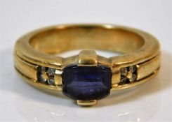 A 9ct gold ring set with tanzanite (small chip) &