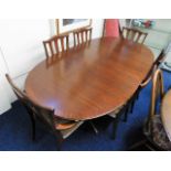 A G-Plan teak extending dining table with six chai