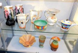 A quantity of art deco style pottery items, conten