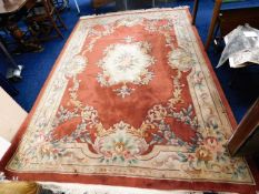 A large Chinese wool rug 120in long x 84in wide ex