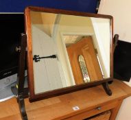 An oak framed dressing table mirror