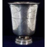 An antique French 0.950 silver tulip cup with chased decor