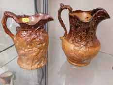 Two stoneware jugs, one with repaired chip, tallest 7.75in