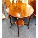 An Edwardian mahogany table 28.5in high x 24in dia