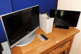 A small Toshiba television, one other & a paper sh