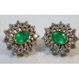 A pair of 14ct gold earrings set with approx. 2ct diamonds & 2ct emeralds 12.4g