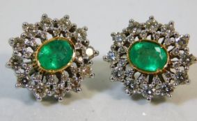 A pair of 14ct gold earrings set with approx. 2ct diamonds & 2ct emeralds 12.4g