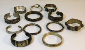 A quantity of white metal & other bangles